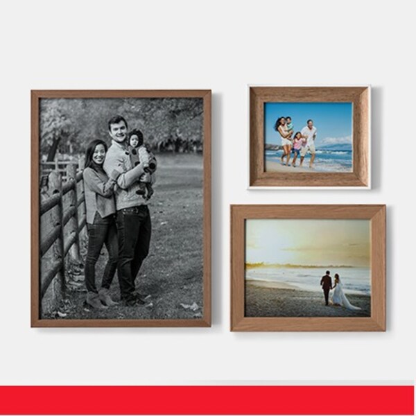 five wood frames with family photographs